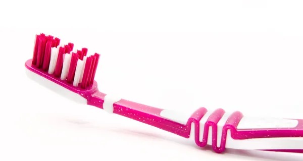Roze tandenborstel geïsoleerd op wit — Stockfoto