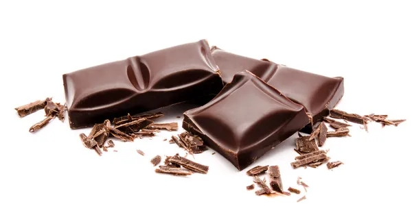Mörka chokladkakor stack med smulor isolerad på en vit Royaltyfria Stockfoton