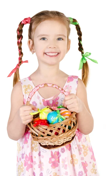 Smiling little girl with basket full of colorful easter eggs iso — Stock Photo, Image