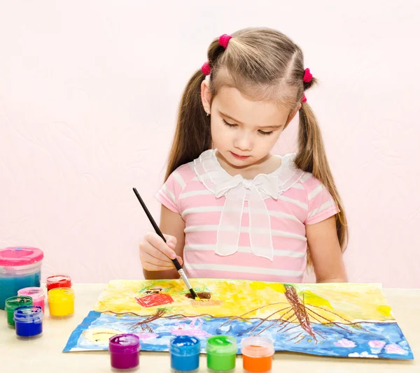 Cute little girl drawing with paint and paintbrush — Stock Photo, Image
