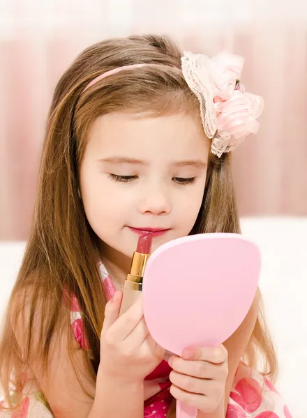 Little girl with lipstick and  mirror — Stock Photo, Image
