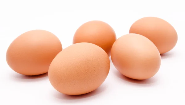Five brown chicken eggs isolated on a white background — Stock Photo, Image