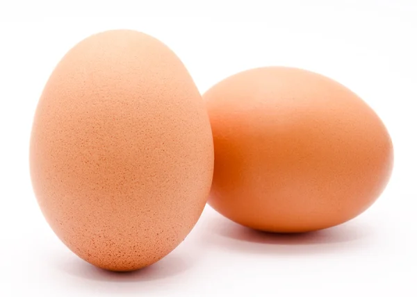 Two brown chicken eggs isolated on a white background — Stock Photo, Image