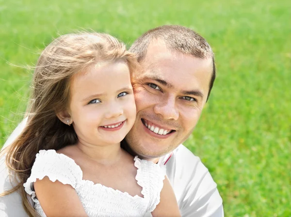 Outdoor portrait of happy smiling young man and little girl — Stock Photo, Image