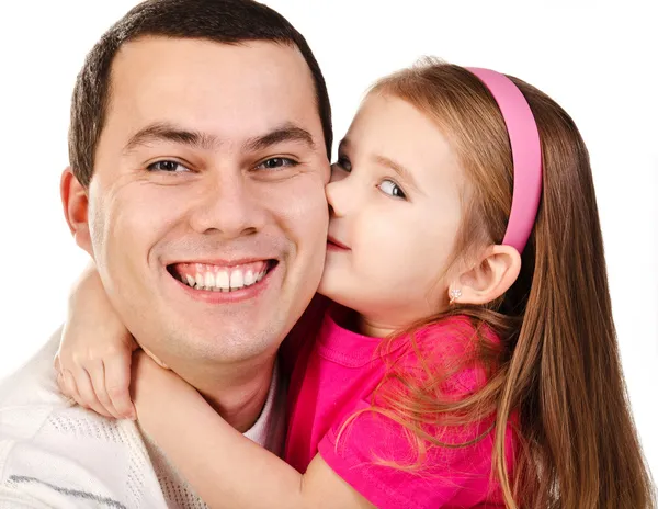 Little girl kissing her smiling father isolated — Stock Photo, Image