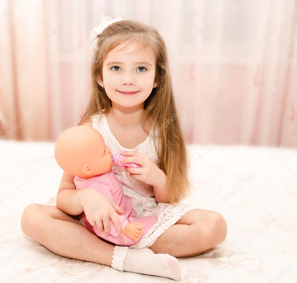 little girl with doll