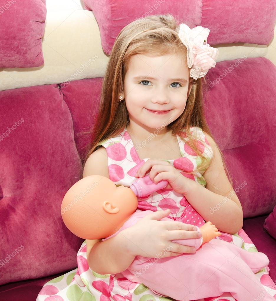 little girls playing dolls