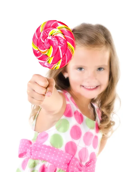 Happy little girl with lollipop foreground isolated — Stockfoto