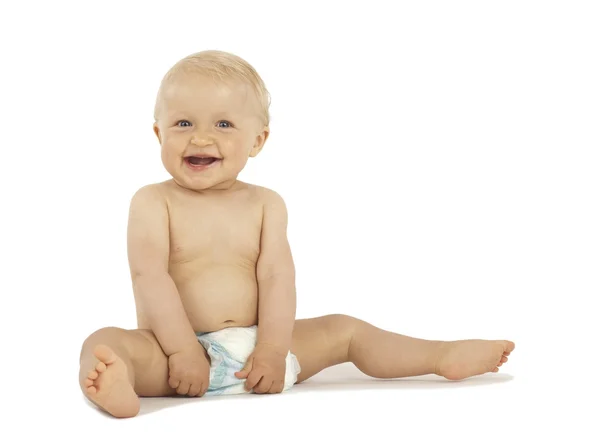 Sonriente bebé sentado sobre fondo blanco Fotos de stock libres de derechos