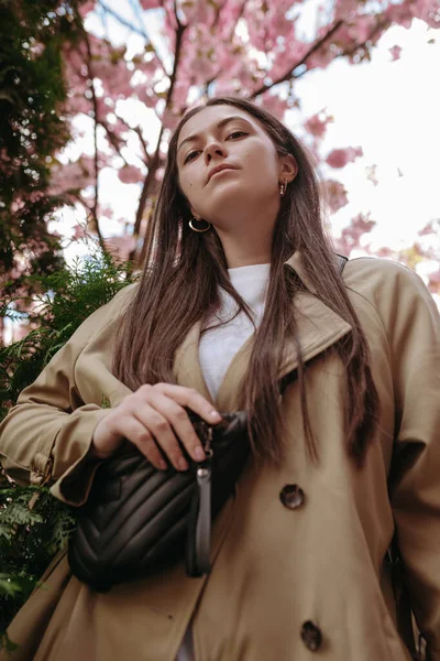 Confident Trendy Woman Long Brown Hair Waist Bag Posing Looking — стоковое фото