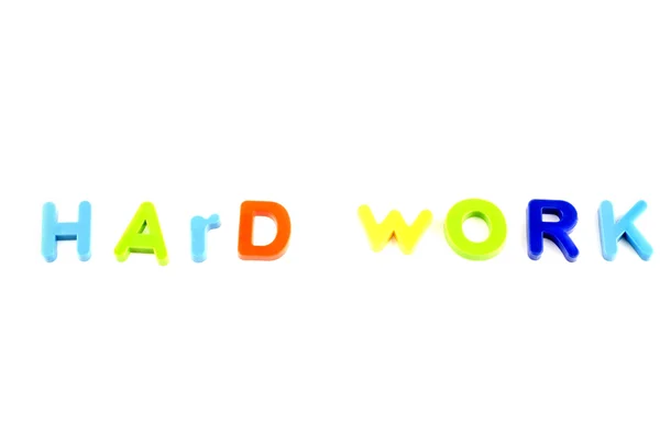 Ordet hardwork från plastleksaker brev — Stockfoto