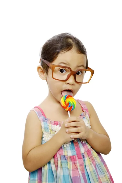 Linda niña comiendo piruleta —  Fotos de Stock