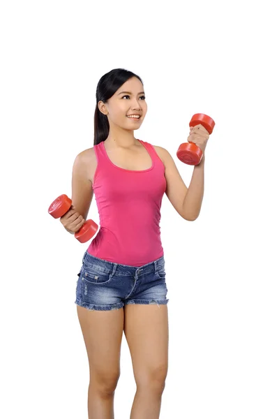 Happy fitness woman lifting dumbbells — Stock Photo, Image