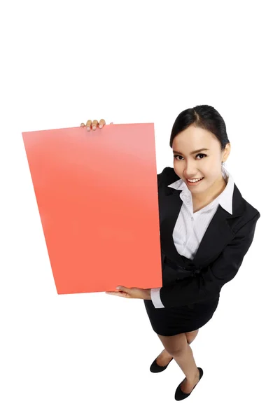 Success woman holding red board shoot in high and wide angle vie Stock Photo