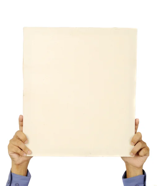 Male hand holds a square canvas — Stock Photo, Image