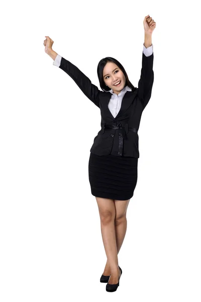 Confident business woman standing full length in black suit. Stock Picture