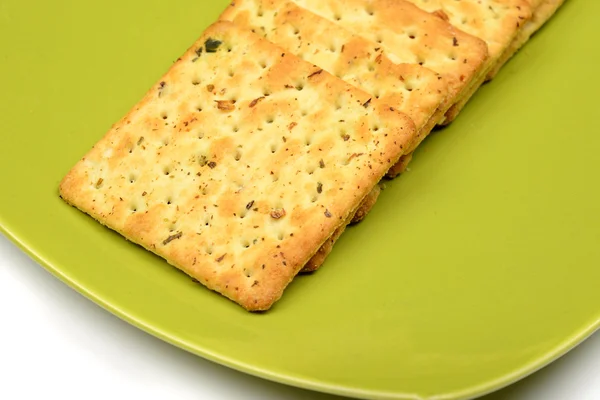 Biscoitos na tigela verde — Fotografia de Stock