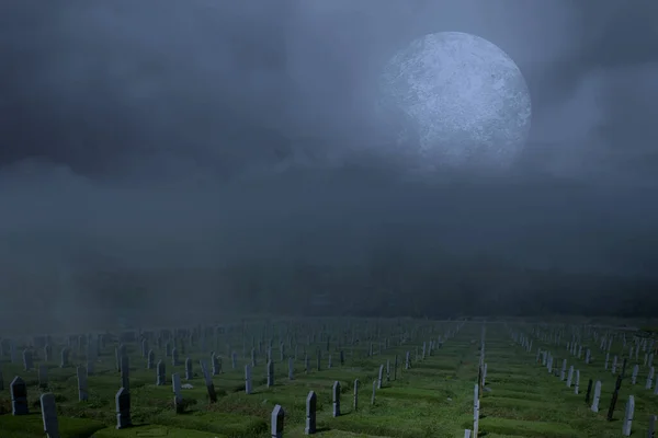 Tombstones on the graveyard with full moon background. Halloween concept