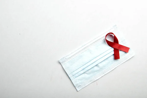 Red Ribbon Face Mask White Background Hiv Aids Ribbon Awareness — Stock Photo, Image