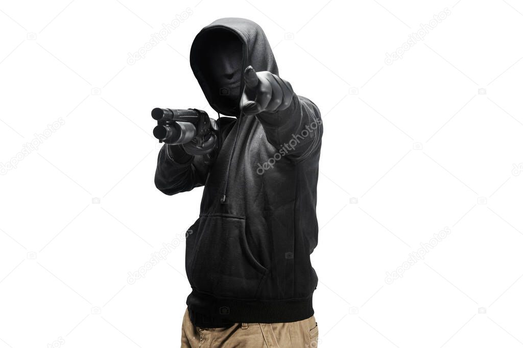 A criminal man in a hidden mask hold the shotgun and pointing something isolated over white background