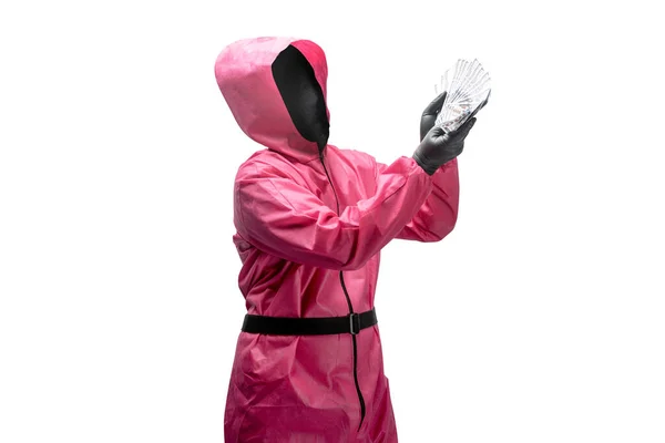 Εγκληματίας Ροζ Στολή Και Μια Κρυμμένη Μάσκα Που Κρατάει Χρήματα — Φωτογραφία Αρχείου