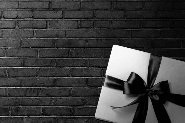 White Gift Box Black Ribbon Black Wall Background Black Friday — Stock Photo, Image