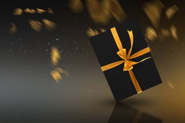 Bulanık ışıklı altın kurdeleli siyah hediye kutusu. Kara Cuma konsepti