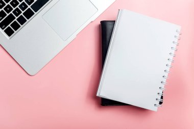 Laptop and note book with colored background