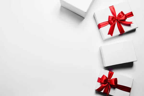 White Gift Box Red Ribbon White Background — Zdjęcie stockowe