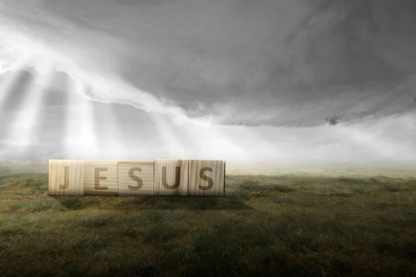 Drewniany Sześcian Tekstem Jezusa Polu Dramatycznym Tle Nieba — Zdjęcie stockowe