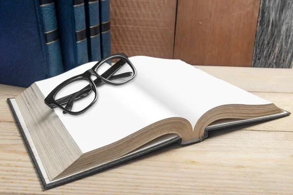 Closeup View Eyeglasses Opened Book Wooden Table — Stock Photo, Image