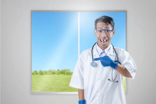 Asian Nerd Scientist Stethoscope Standing Pointing Something Window Glass Background — стоковое фото