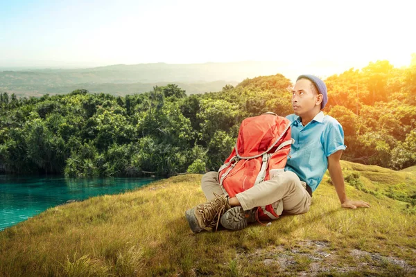 Asian Man Beanie Hat Sitting His Backpack Hill Sunlight Background — Stock Photo, Image