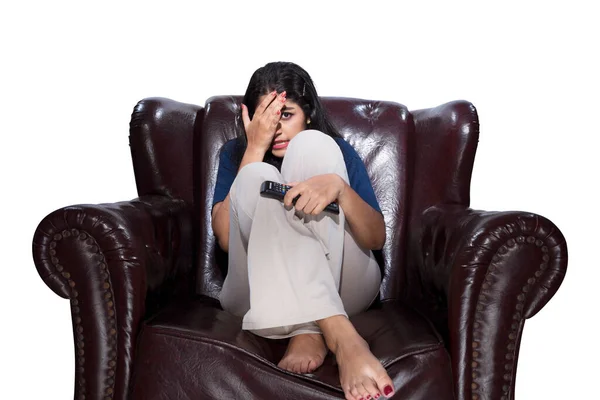 Indian Woman Holding Television Remote Sitting Couch Scared Expression Isolated — Stock Photo, Image