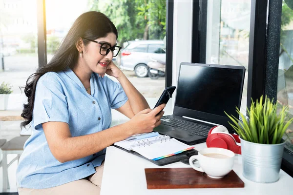 Asian Woman Eyeglass Using Mobile Phone Laptop Notebook Cup Coffee —  Fotos de Stock