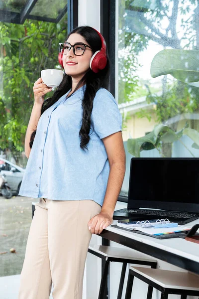 Asian Woman Eyeglass Listening Music Headphones Holding Cup Coffee Laptop —  Fotos de Stock