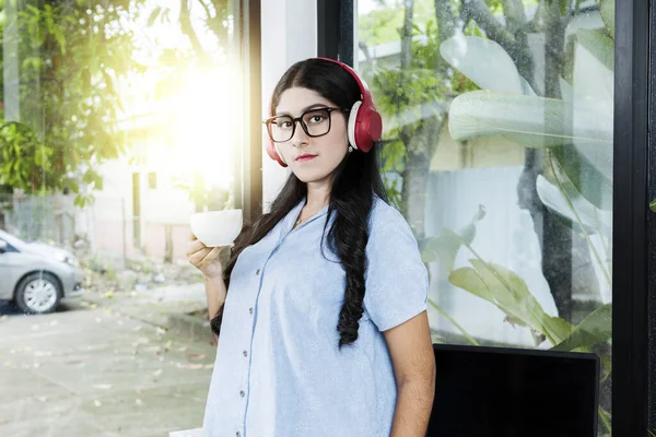 Asian Woman Eyeglass Listening Music Headphones Holding Cup Coffee Laptop —  Fotos de Stock