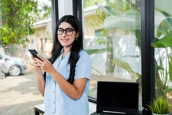 Asian Woman Eyeglass Holding Mobile Phone Laptop Table Coffee Shop — Stockfoto