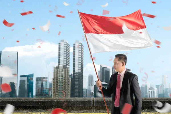 Asian Businessman Holding Indonesian Flag Blue Sky Background Indonesian Independence — Stockfoto