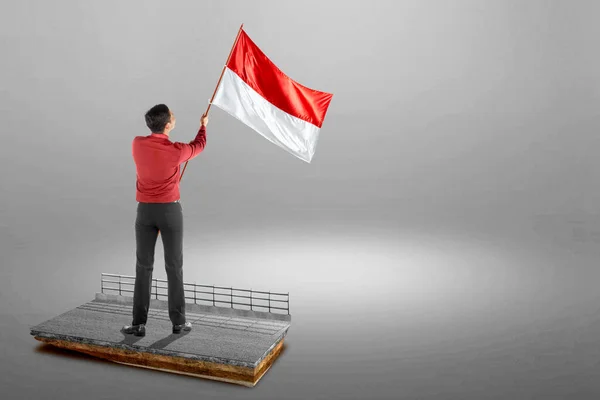 Pandangan Belakang Pengusaha Asia Memegang Bendera Indonesia Dengan Latar Belakang — Stok Foto