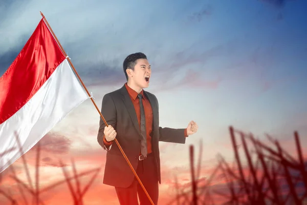 Asian Businessman Holding Indonesian Flag Blue Sky Background Indonesian Independence — Foto Stock