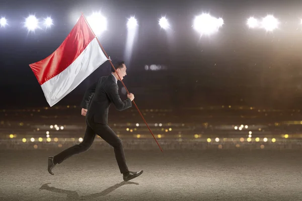 Asian Businessman Running While Carrying Indonesian Flag Spotlights Background Indonesian — Stockfoto