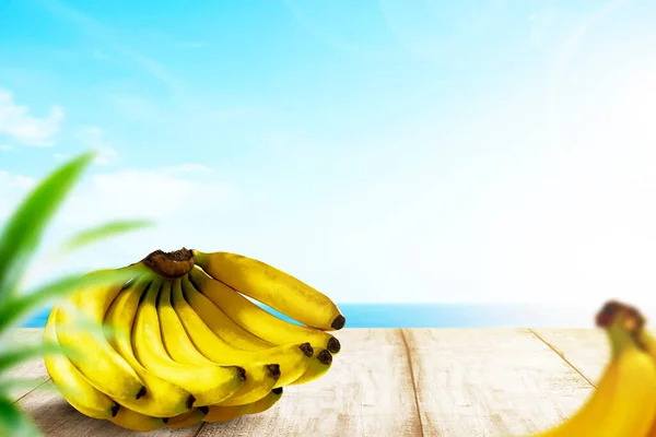 Bunch Bananas Wooden Table Ocean View Blue Sky Background — Stock Photo, Image
