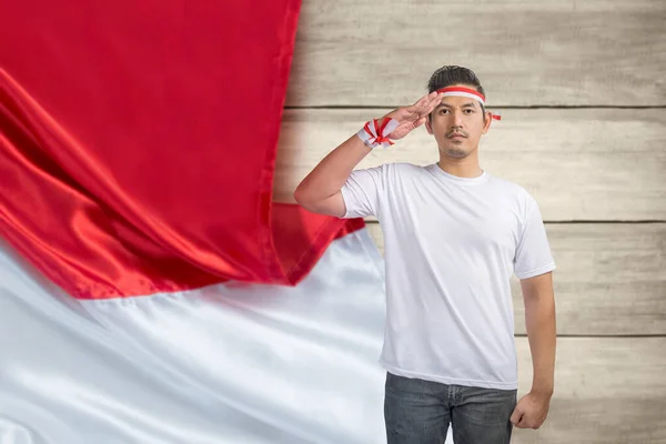 Indonesian men celebrate Indonesian independence day on 17 August with respectful gestures. Indonesian independence day