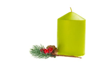 Candle and fir-tree branch isolated over white background