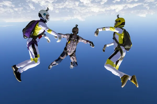 Skydivers topladığı şekil batmak üzere. — Stok fotoğraf