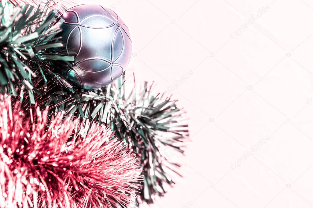 Christmas toned with copy space background for design with branches of a Christmas tree, Christmas decorations and tinsel