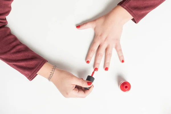 Manicure process at home, nails coating, top view