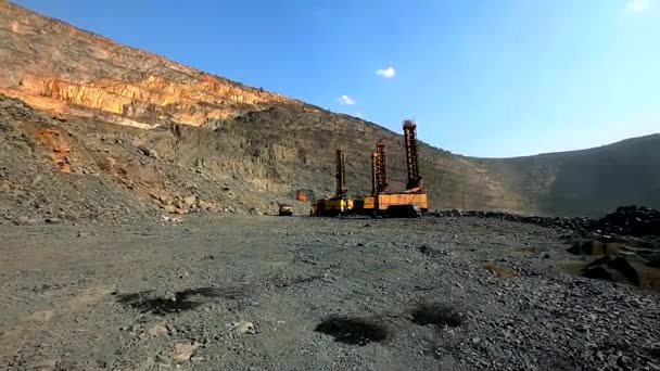 Preparing a quarry for an explosion. Placing a charge in the soil for blasting operations. Explosives in the quarry. Controlled blast soil — Stock Video