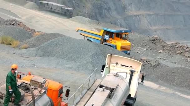 Heavy equipment in the quarry. Equipment for blasting soil in an iron ore quarry. Equipment for explosives in the quarry. — Stockvideo
